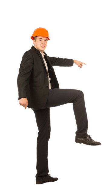 Young Male Engineer Lifting One Leg Posing - 写真・画像