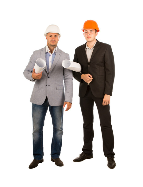 Männliche Ingenieure mittleren Alters mit Bauplänen - Foto, Bild