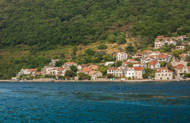 Bay of Kotor, view from the sea to the old town of Herceg Novi in Montenegro, Europe, Adriatic Sea and mountains - Photo, Image