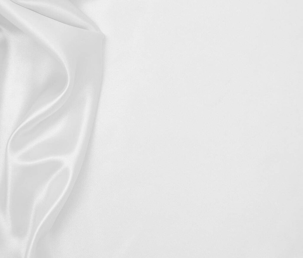 Smooth elegant white silk or satin luxury cloth texture can use as wedding background. Luxurious background design - Photo, image