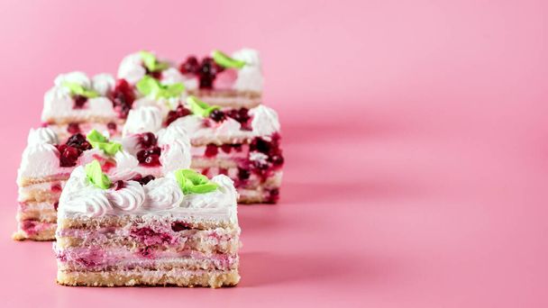 Pieces of Tasty Homemade Biscuit Cake on Pink Background Tasty Dessert with Cream Horizontal - Fotoğraf, Görsel
