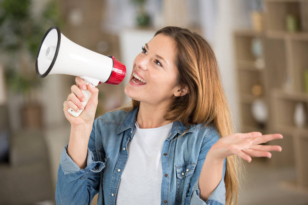 happy carefree woman making megaphone announcement - Photo, image