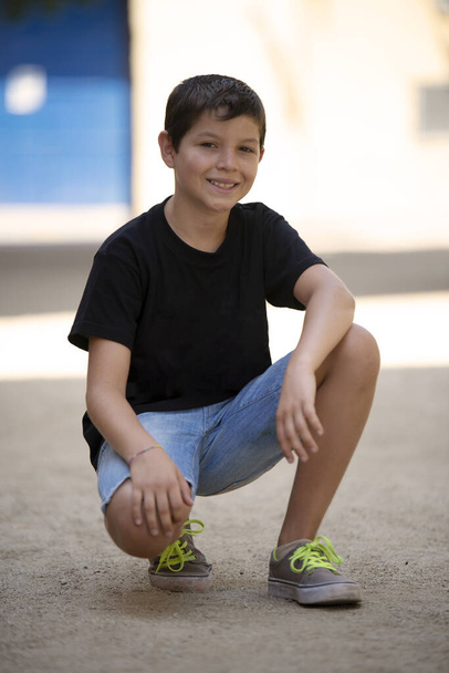 Portrait of handsome male child in the city outdoors. Natural light. - Fotoğraf, Görsel