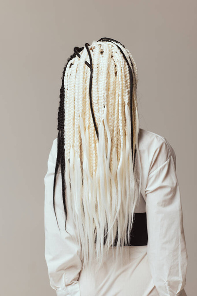 a young woman with afrokos black on white background. - 写真・画像