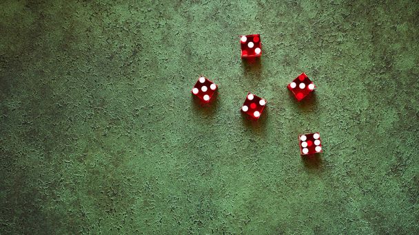 Red casino dice top view on green textured background, the concept of gambling - Foto, Bild