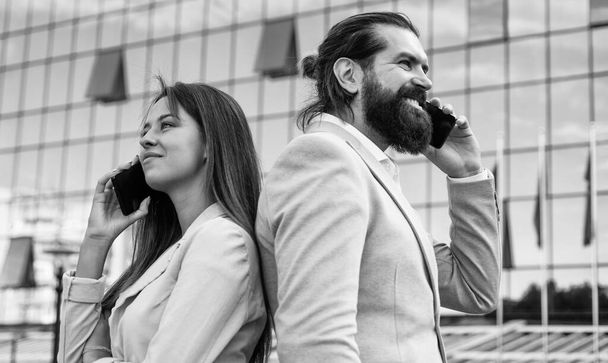 business couple speak on phone outdoor, communication - Fotó, kép