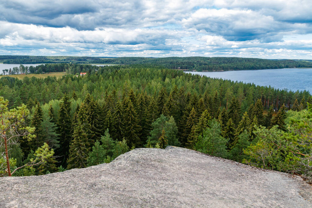 Beautiful view to the lake Pyhajarvi from mountain Hiidenvuori on island Hiidensaari, Finland - 写真・画像