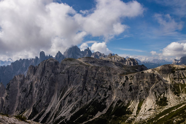 Clouds over mountain trail Tre Cime di Lavaredo in Dolomites in Italy - Fotó, kép