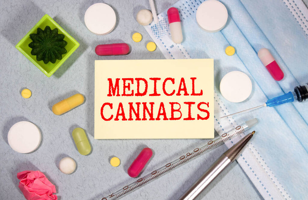 Paper with text MEDICAL CANNABIS on table with stethoscope - Φωτογραφία, εικόνα