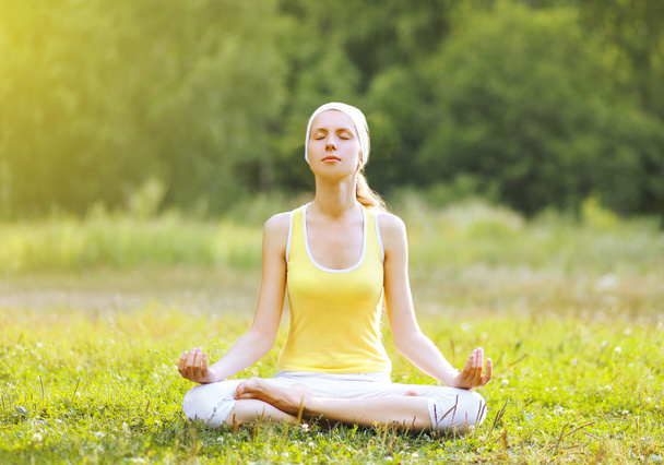 Yoga girl meditates outdoors - Photo, Image