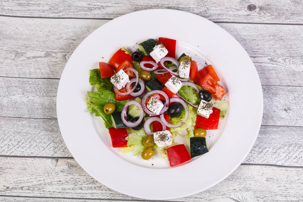 Traditional Greek salad with feta cheese, vegetables and herbs - Foto, Bild