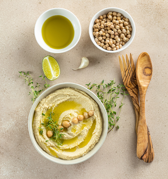 Hummus, mashed chickpeas with lime, spices, olive oil, and herbs - 写真・画像
