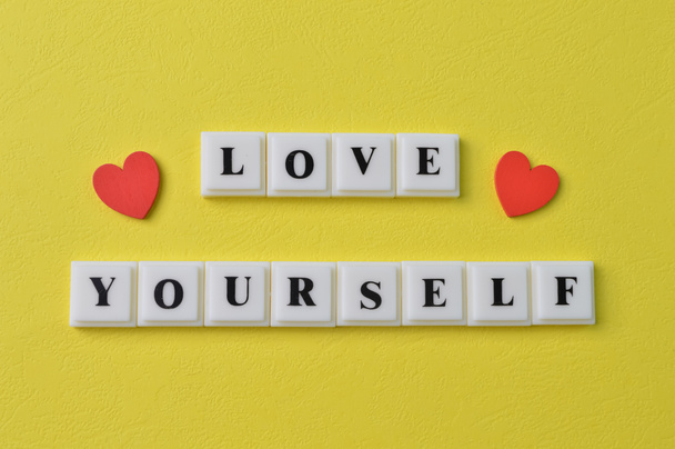 Love shapes and square letters with text LOVE YOURSELF - Foto, immagini