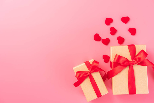 Giving present and celebration concept at Valentine's day, anniversary, mother's day and birthday surprise on pink background, copyspace, topview - Photo, Image