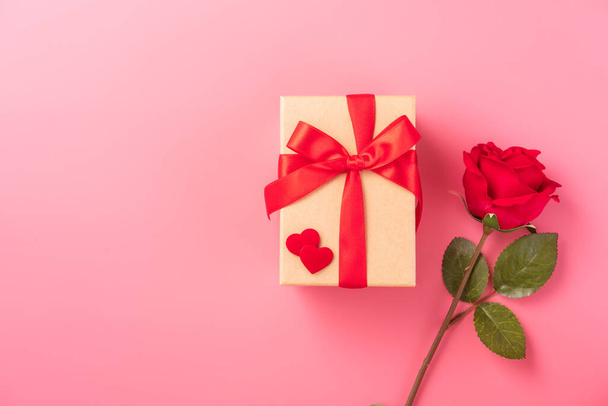 Giving present and celebration concept at Valentine's day, anniversary, mother's day and birthday surprise on pink background, copyspace, topview - Φωτογραφία, εικόνα