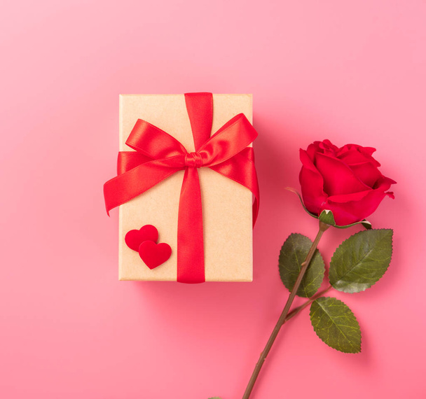 Giving present and celebration concept at Valentine's day, anniversary, mother's day and birthday surprise on pink background, copyspace, topview - Photo, image