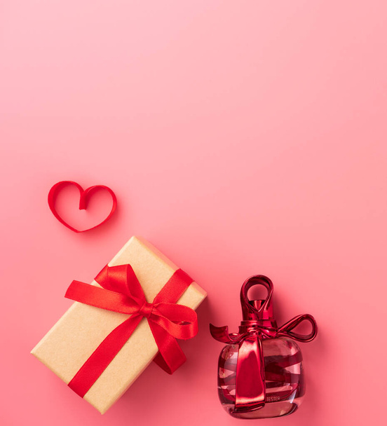 Giving present and celebration concept at Valentine's day, anniversary, mother's day and birthday surprise on pink background, copyspace, topview - Foto, imagen