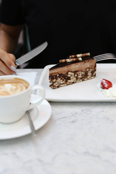 Board with delicious cake on table - Photo, Image