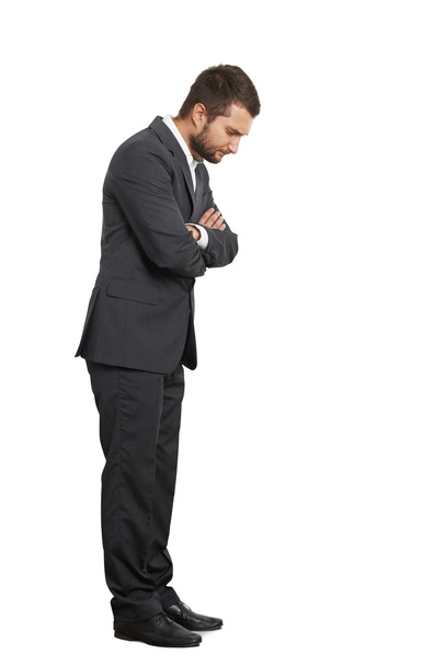 displeased young businessman looking down - Photo, Image