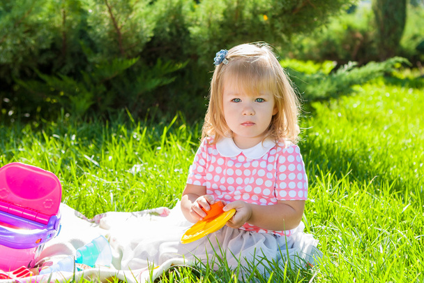 little girl in the Sunny meadow - Фото, изображение