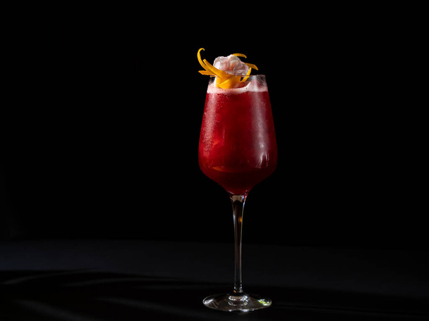 Glass of fresh colorful cocktail on black background - Photo, image