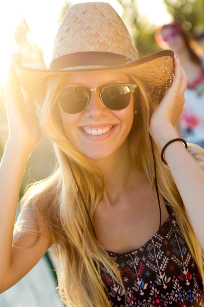 Young attractive woman with hat on a summer day. - Foto, Bild