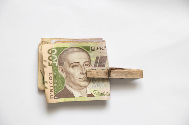 Ukrainian money in a money clip on an isolated background, finance - Fotografie, Obrázek