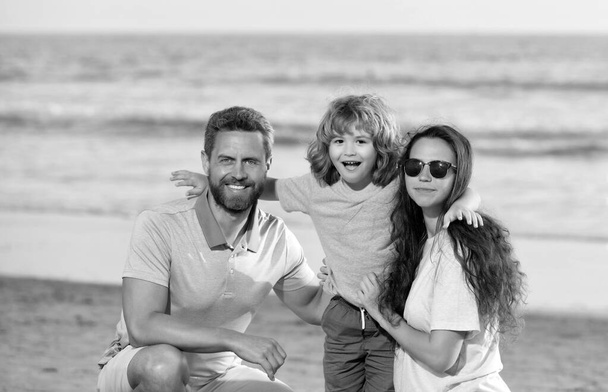 happy family portrait of mother father and son kid on malibu beach in summer vacation, family - Photo, image
