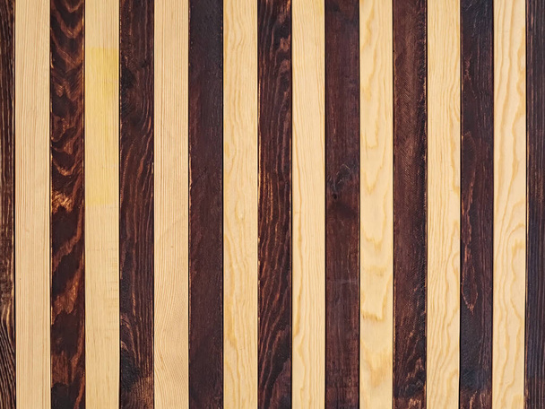 Background of alternating dark and light wooden planks. Seamless striped pattern - Foto, immagini