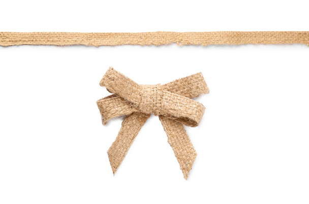 Pretty burlap bow and ribbon on white background  - Foto, immagini