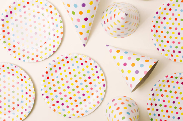 Party set with polka dots. Plates and caps. Flat lay. - Photo, image