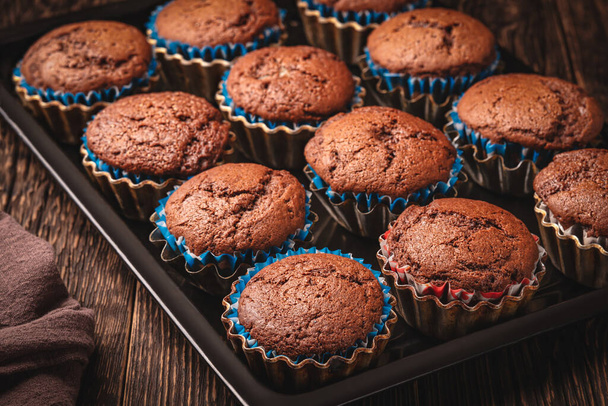 Homemade chocolate muffins in baking sheet - Foto, Imagem