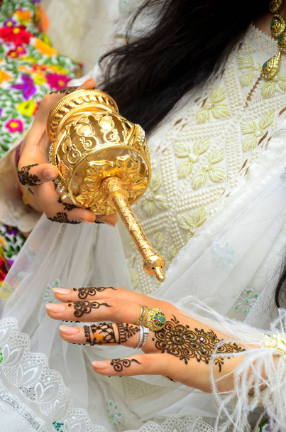 Moroccan bride puts flower water on her hands. Moroccan henna - Photo, Image