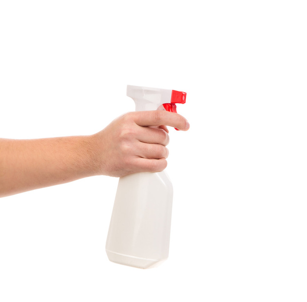 Hand holding spray bottle. - Fotó, kép