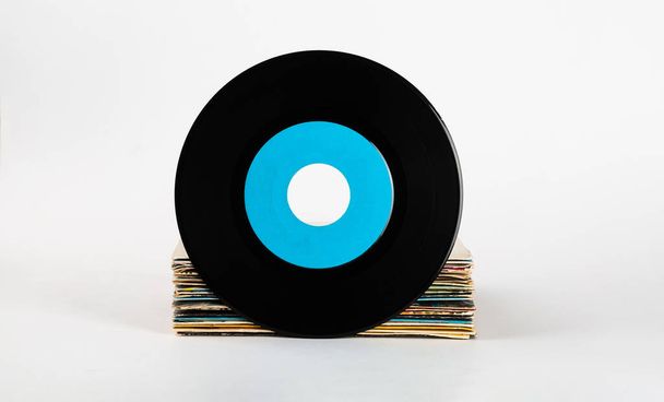 Old music vinyl record with blank label on white background, copy space, mock up. - Foto, Bild