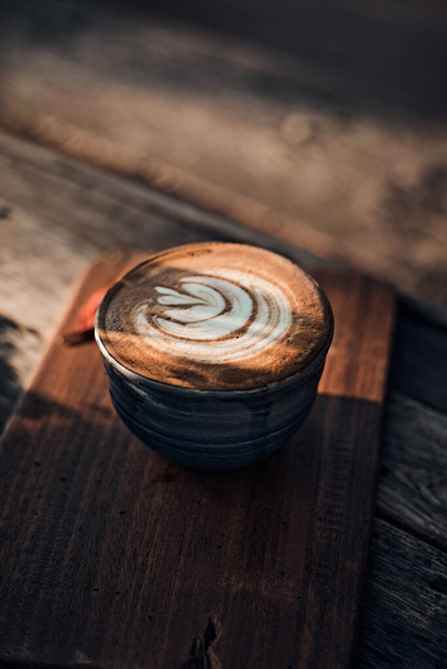 Selective focus cup of hot latte art coffee,focus at white foa - Fotoğraf, Görsel