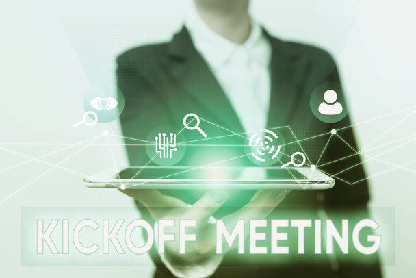 Sign displaying Kickoff Meeting. Business concept Special discussion on the legalities involved in the project Lady In Suit Presenting Mobile Device With Futuristic Interface Tech. - Foto, Imagem