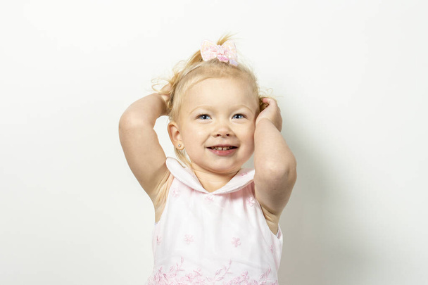 Little girl with makeup posing on a light background. Banner. Concept little model, princess. - Foto, Bild