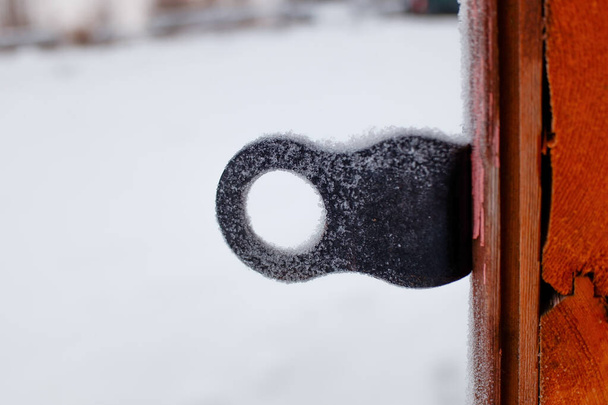 the eyelet for the padlock is all in frost - Φωτογραφία, εικόνα