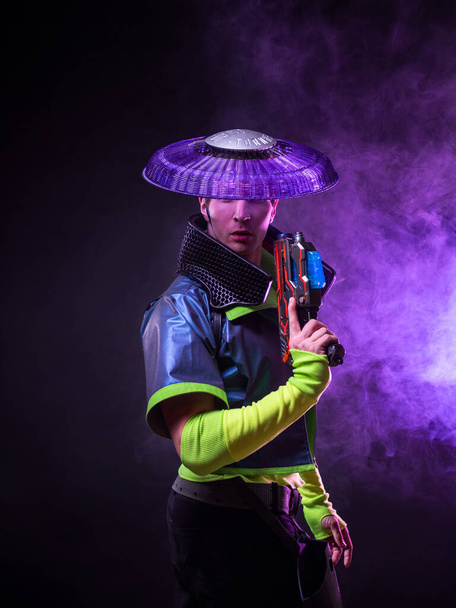 Futuristic character in a bright stylized outfit, photo with neon colors. - Photo, image