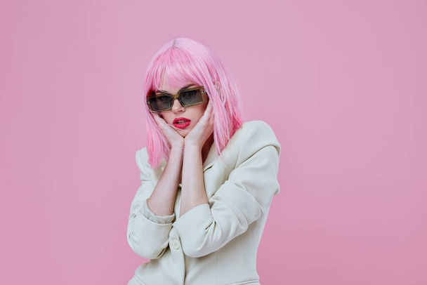 Young woman wearing sunglasses pink hair posing color background unaltered - Photo, Image