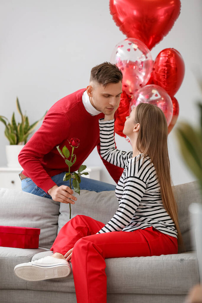 Happy couple celebrating Valentine's Day at home - Fotografie, Obrázek