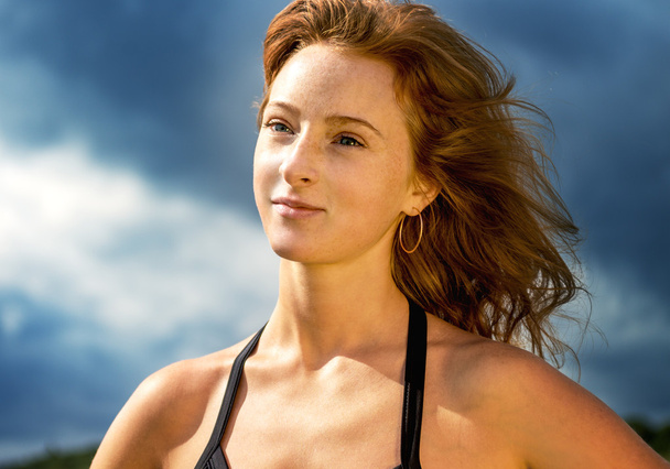Portrait sports beautiful girl with red hair - Photo, Image