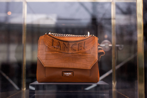 Strasbourg - France - 25 December 2021 - Closeup of brown leather handbag by Lancel in a uxury fashion store showroom - Fotoğraf, Görsel