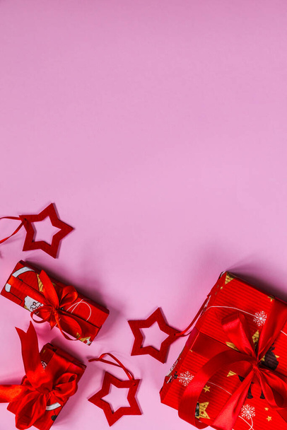 Vertical Christmas and New Year's Greeting Card design. Pink background - 写真・画像