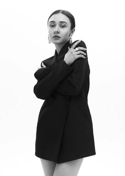 monochrome portrait of a girl in a short dress with accessories - Fotografie, Obrázek
