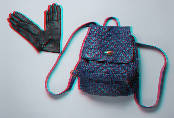 Leather fashionable backpack, gloves on gray background. Trend accessories.  Glitch effect. Top view - Photo, Image