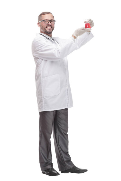 smiling doctor with a laboratory flask in his hands . - Foto, imagen