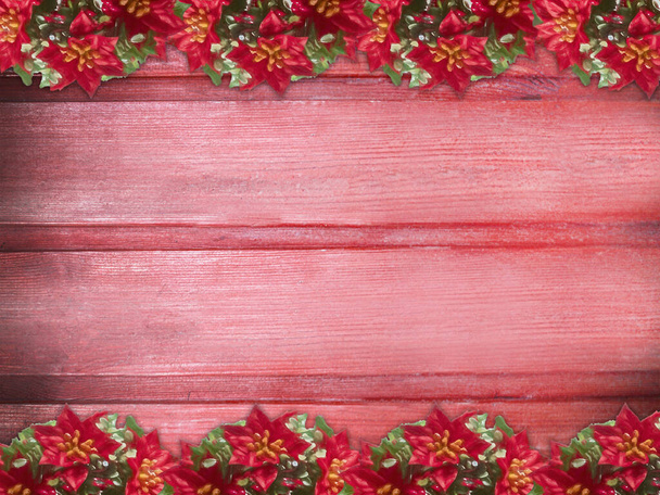 Winter wooden rose pink red strawberry nature background with poinsettia two sides. Texture of painted wood horizontal boards. Christmas, New Year card with copy space. Card for congratulation, invitation, party, message for Christmas, New Year. Can  - Фото, зображення