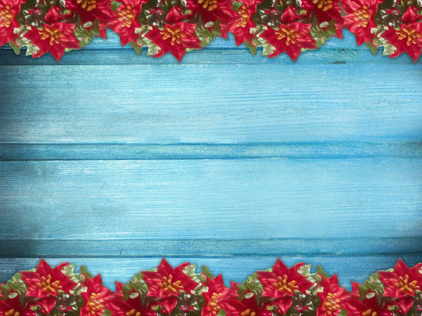 Winter wooden blue nature background with poinsettia two sides. Texture of painted wood horizontal boards. Christmas, New Year card with copy space. Card for congratulation, invitation, party, message for Christmas, New Year. Can be used for websites - Foto, Imagem